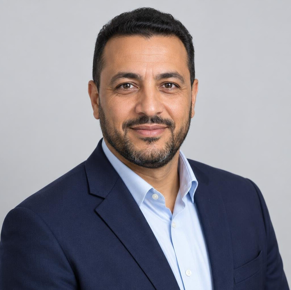 Studio portrait of a man with a beard wearing a blazer