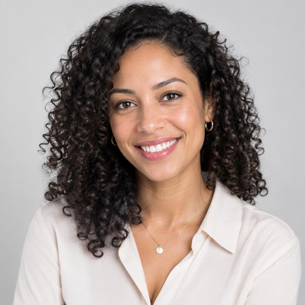 Studio portrait of a young professional woman with curly hair